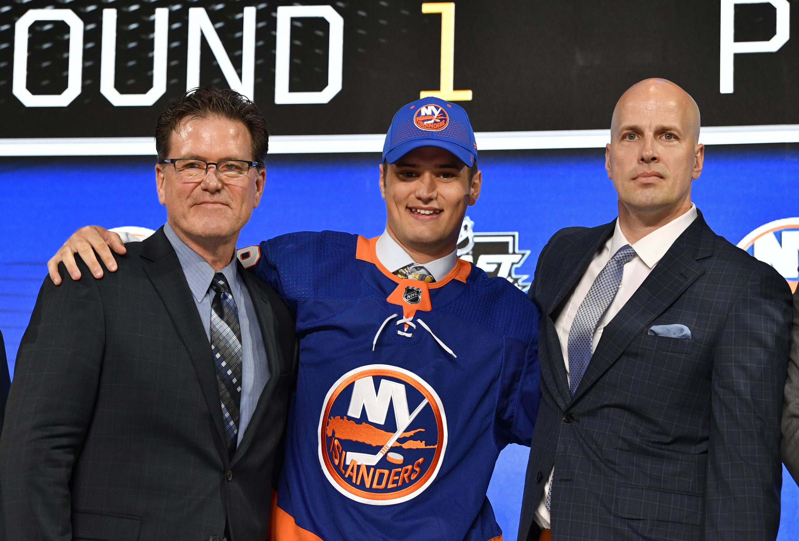 Jun 22, 2018; Dallas, TX, USA; Oliver Wahlstrom poses for a photo with team representatives after being selected as the number eleven overall pick to the New York Islanders in the first round of the 2018 NHL Draft at American Airlines Center. Mandatory Credit: Jerome Miron-USA TODAY Sports