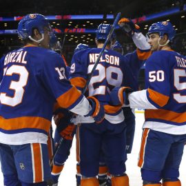 Mar 30, 2018; Brooklyn, NY, USA; New York Islanders center Brock Nelson (29) celebrates with center Mathew Barzal (13) and defenseman Adam Pelech (50) after scoring a goal against Toronto Maple Leafs during the second period at Barclays Center. Mandatory Credit: Noah K. Murray-USA TODAY Sports