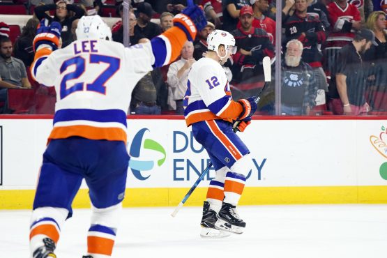 Oct 4, 2018; Raleigh, NC, USA; New York Islanders right wing Josh Bailey (12) celebrates his game winning overtime goal against the Carolina Hurricanes at PNC Arena. The New York Islanders defeated the Carolina Hurricanes 2-1 in the overtime. Mandatory Credit: James Guillory-USA TODAY Sports