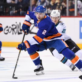 Oct 8, 2018; Brooklyn, NY, USA; New York Islanders defenseman Nick Leddy (2) skates with the puck across the blue line defended by San Jose Sharks left wing Marcus Sorensen (20) during the second period at Barclays Center. Mandatory Credit: Dennis Schneidler-USA TODAY Sports