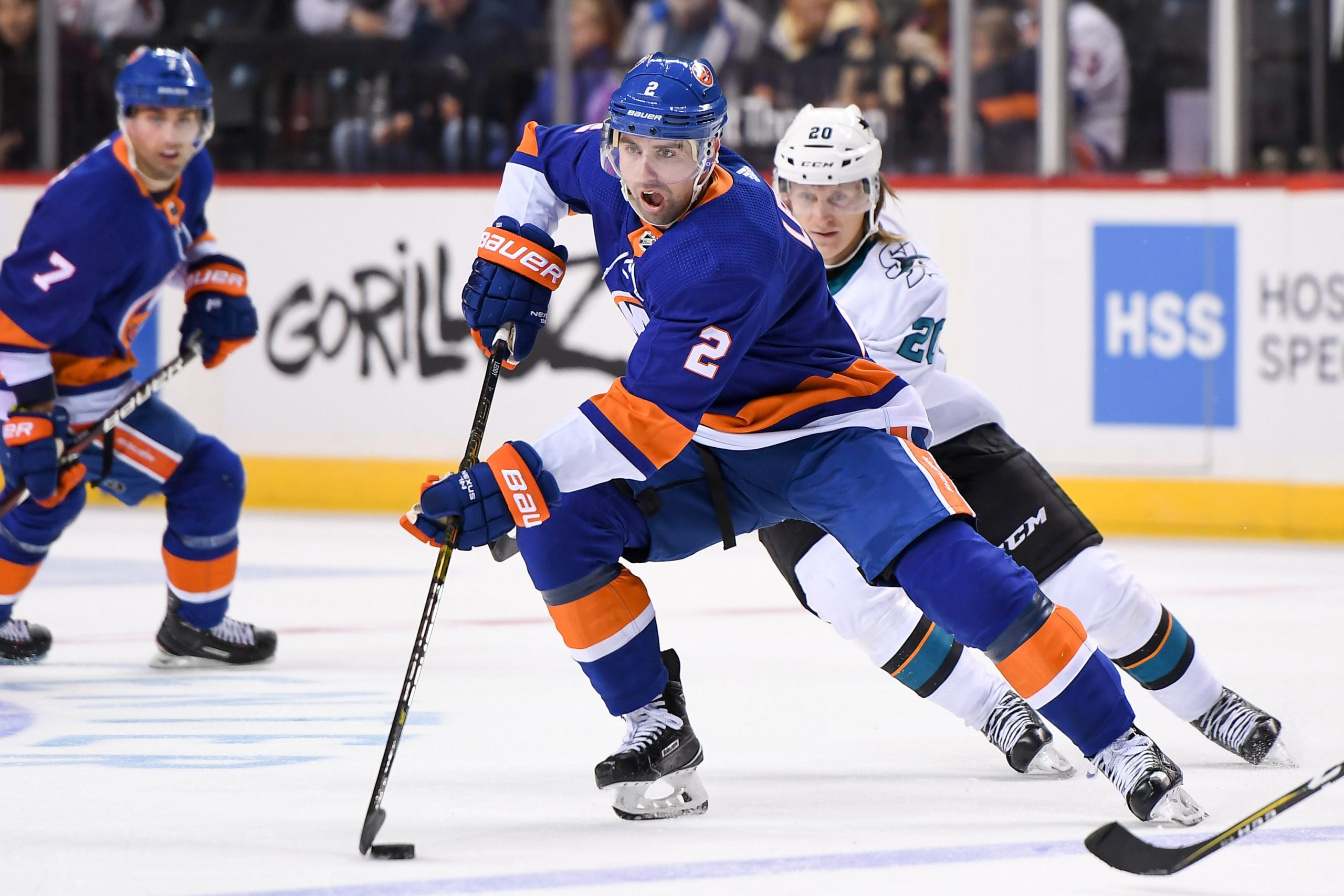 Oct 8, 2018; Brooklyn, NY, USA; New York Islanders defenseman Nick Leddy (2) skates with the puck across the blue line defended by San Jose Sharks left wing Marcus Sorensen (20) during the second period at Barclays Center. Mandatory Credit: Dennis Schneidler-USA TODAY Sports