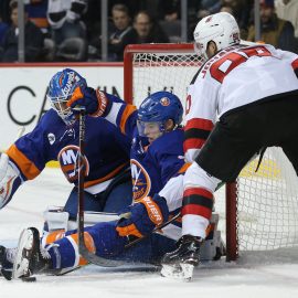 Nov 3, 2018; Brooklyn, NY, USA; New York Islanders goaltender Thomas Greiss (1) makes a save against New Jersey Devils left wing Marcus Johansson (90) in front of Islanders defenseman Thomas Hickey (4) during the third period at Barclays Center. Mandatory Credit: Brad Penner-USA TODAY Sports