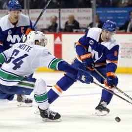 Nov 13, 2018; Brooklyn, NY, USA; New York Islanders defenseman Nick Leddy (2) plays the puck against Vancouver Canucks center Tyler Motte (64) during the second period at Barclays Center. Mandatory Credit: Brad Penner-USA TODAY Sports