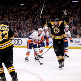 Nov 29, 2018; Boston, MA, USA; Boston Bruins left wing Jake DeBrusk (74) celebrates after a goal by Boston left wing Brad Marchand (63) against the New York Islanders during the second period at TD Garden. Mandatory Credit: Paul Rutherford-USA TODAY Sports