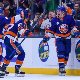 Dec 15, 2018; Uniondale, NY, USA; New York Islanders center Mathew Barzal (13) celebrates with New York Islanders defenseman Nick Leddy (2) and New York Islanders left wing Anders Lee (27) after scoring a goal against the Detroit Red Wings during the third period at Nassau Veterans Memorial Coliseum. Mandatory Credit: Dennis Schneidler-USA TODAY Sports