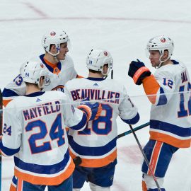 Dec 18, 2018; Glendale, AZ, USA; New York Islanders left wing Anthony Beauvillier (18) celebrates with teammates after scoring a goal in the second period against the Arizona Coyotes at Gila River Arena. Mandatory Credit: Matt Kartozian-USA TODAY Sports