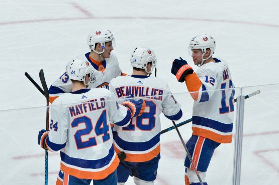 Dec 18, 2018; Glendale, AZ, USA; New York Islanders left wing Anthony Beauvillier (18) celebrates with teammates after scoring a goal in the second period against the Arizona Coyotes at Gila River Arena. Mandatory Credit: Matt Kartozian-USA TODAY Sports
