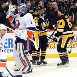 Dec 6, 2018; Pittsburgh, PA, USA; Pittsburgh Penguins winger Phil Kessel (81) celebrates a second period goal with captain Sidney Crosby (87) and winger Jake Guentzel (59) against the New York Islanders at PPG PAINTS Arena. Mandatory Credit: Philip G. Pavely-USA TODAY Sports