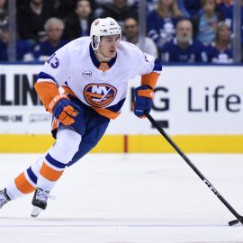 Dec 29, 2018; Toronto, Ontario, CAN; New York Islanders forward Mathew Barzal (13) skates the puck up ice against Toronto Maple Leafs in the third period at Scotiabank Arena. Barzal scored a natural hat trick in a 4-0 win for the Islanders. Mandatory Credit: Dan Hamilton-USA TODAY Sports