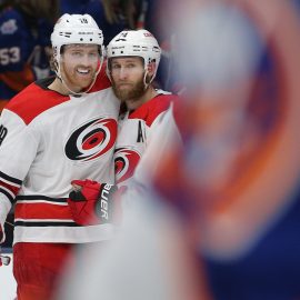 Jan 8, 2019; Uniondale, NY, USA; Carolina Hurricanes defenseman Jaccob Slavin (74) celebrates with defenseman Dougie Hamilton (19) after scoring the go ahead goal against the New York Islanders during the third period at Nassau Veterans Memorial Coliseum. Mandatory Credit: Brad Penner-USA TODAY Sports