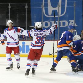 Jan 12, 2019; Brooklyn, NY, USA; New York Rangers right wing Mats Zuccarello (36) celebrates his game winning goal against New York Islanders goalie Robin Lehner (40) with Rangers left wing Chris Kreider (20) during the third period at Barclays Center. Mandatory Credit: Brad Penner-USA TODAY Sports