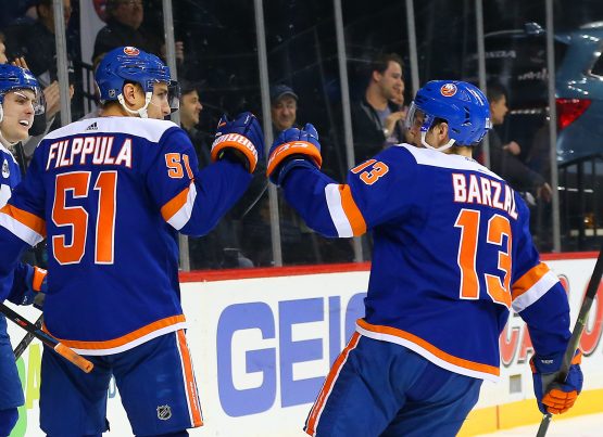 Jan 15, 2019; Brooklyn, NY, USA; New York Islanders center Valtteri Filppula (51) is congratulated by center Mathew Barzal (13) after scoring the game winning goal against the St. Louis Blues during overtime at Barclays Center. Mandatory Credit: Andy Marlin-USA TODAY Sports