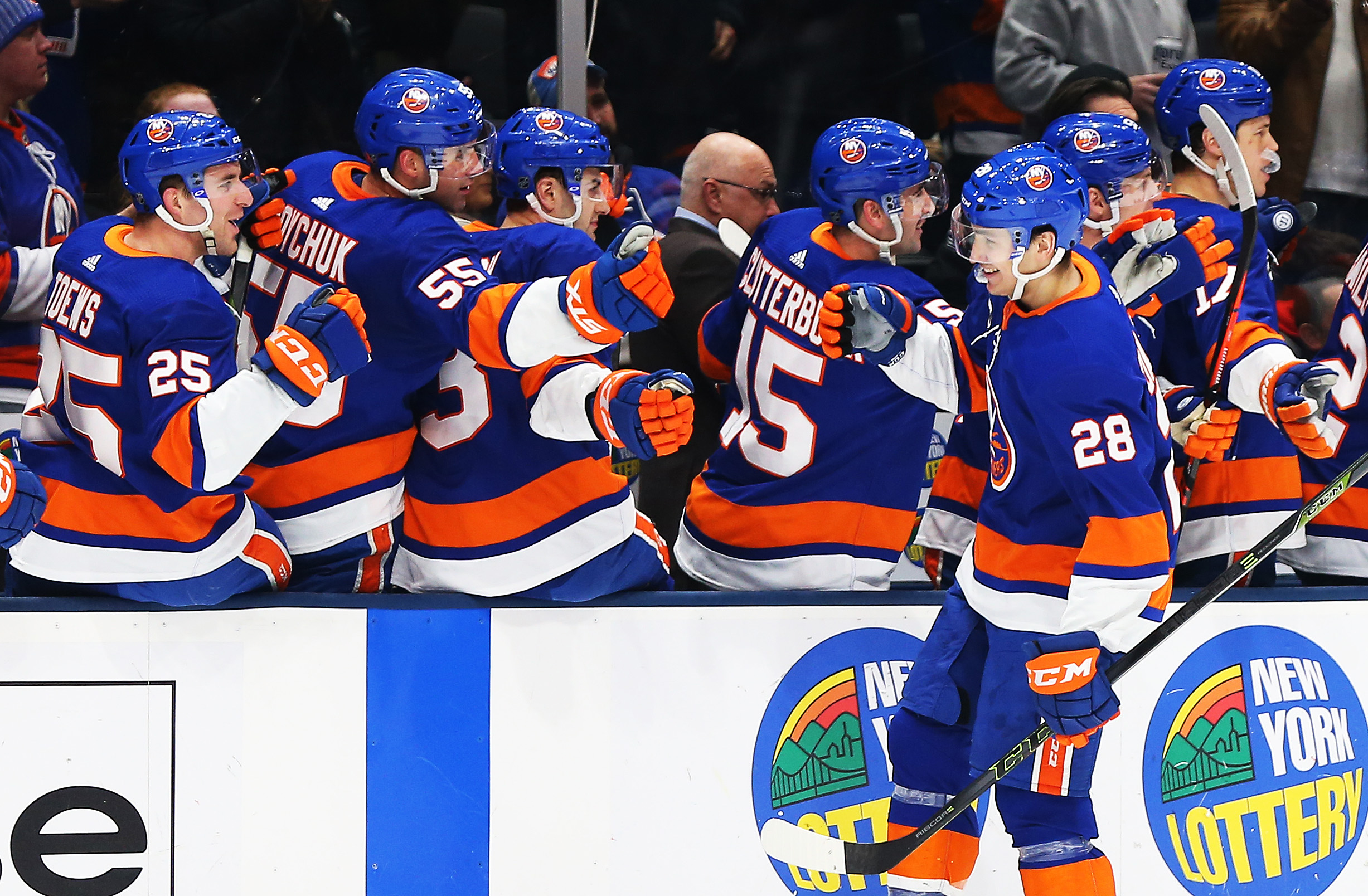Jan 17, 2019; Uniondale, NY, USA; New York Islanders left wing Michael Dal Colle (28) celebrates with teammates on the bench after scoring a goal against the New Jersey Devils during the first period at Nassau Veterans Memorial Coliseum. Mandatory Credit: Andy Marlin-USA TODAY Sports