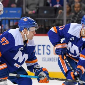 Dec 4, 2018; Brooklyn, NY, USA; New York Islanders center Valtteri Filppula (51) skates the puck across the blue line with New York Islanders right wing Tom Kuhnhackl (14) and New York Islanders right wing Leo Komarov (47) against the Winnipeg Jets during the second period at Barclays Center. Mandatory Credit: Dennis Schneidler-USA TODAY Sports