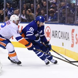 Dec 29, 2018; Toronto, Ontario, CAN; Toronto Maple Leafs forward John Tavares (91) battles for the puck against New York Islanders defenseman Nick Leddy (2) in the second period at Scotiabank Arena. Mandatory Credit: Dan Hamilton-USA TODAY Sports