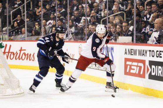 Jan 31, 2019; Winnipeg, Manitoba, CAN; Columbus Blue Jackets forward Artemi Panarin (9) skates away fromWinnipeg Jets defenseman Josh Morrissey (44) during the first period at Bell MTS Place. Mandatory Credit: Terrence Lee-USA TODAY Sports