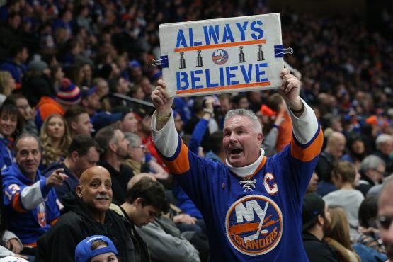 Feb 1, 2019; Uniondale, NY, USA; A fan of the New York Islanders displays a sign during the third period against the Tampa Bay Lightning at Nassau Veterans Memorial Coliseum. Mandatory Credit: Brad Penner-USA TODAY Sports