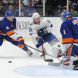 Feb 1, 2019; Uniondale, NY, USA; New York Islanders goalie Thomas Greiss (1) stops a shot by Tampa Bay Lightning center Brayden Point (21) in front of Islanders defenseman Ryan Pulock (6) during the third period at Nassau Veterans Memorial Coliseum. Mandatory Credit: Brad Penner-USA TODAY Sports