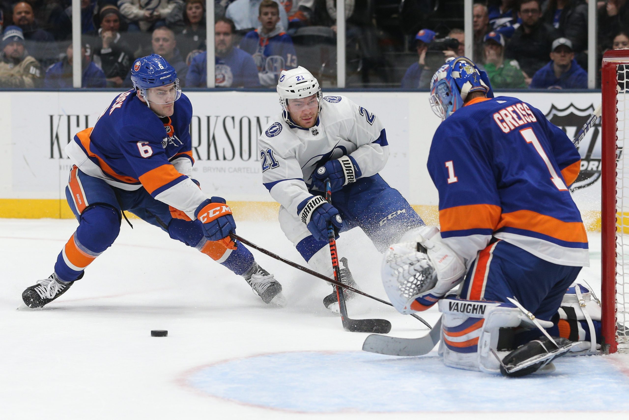 Feb 1, 2019; Uniondale, NY, USA; New York Islanders goalie Thomas Greiss (1) stops a shot by Tampa Bay Lightning center Brayden Point (21) in front of Islanders defenseman Ryan Pulock (6) during the third period at Nassau Veterans Memorial Coliseum. Mandatory Credit: Brad Penner-USA TODAY Sports