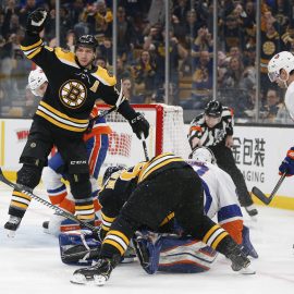 Feb 5, 2019; Boston, MA, USA; Boston Bruins center Patrice Bergeron (37) reacts after scoring a goal on New York Islanders goaltender Robin Lehner (40) during the second period at TD Garden. Mandatory Credit: Greg M. Cooper-USA TODAY Sports