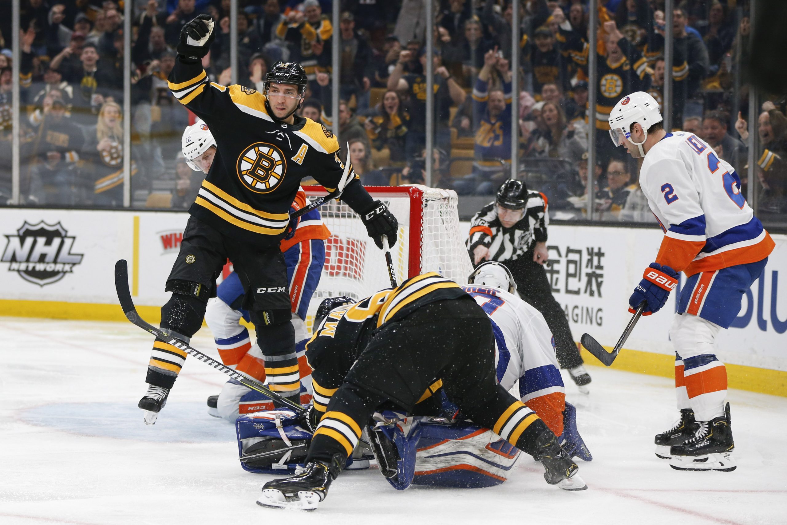 Feb 5, 2019; Boston, MA, USA; Boston Bruins center Patrice Bergeron (37) reacts after scoring a goal on New York Islanders goaltender Robin Lehner (40) during the second period at TD Garden. Mandatory Credit: Greg M. Cooper-USA TODAY Sports