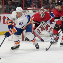 Mar 7, 2019; Ottawa, Ontario, CAN; New York Islanders right wing Leo Komarov (47) skates with the puck in front of Ottawa Senators defenseman Cody Ceci (5) in the first period at the Canadian Tire Centre. Mandatory Credit: Marc DesRosiers-USA TODAY Sports