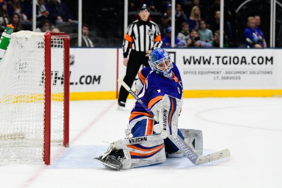 Mar 11, 2019; Uniondale, NY, USA; New York Islanders goalie Thomas Greiss (1) deflects a puck against the Columbus Blue Jackets during the third period at Nassau Veterans Memorial Coliseum. Mandatory Credit: Catalina Fragoso-USA TODAY Sports