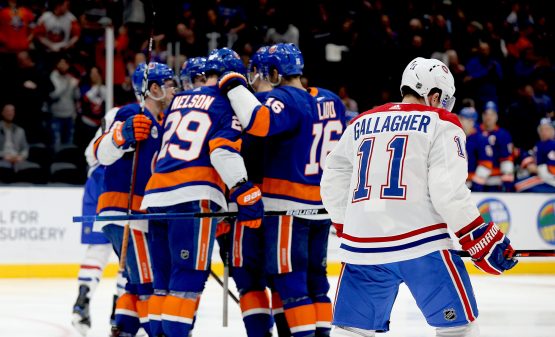 Mar 14, 2019; Uniondale, NY, USA; Montreal Canadiens right wing Brendan Gallagher (11) skates away as the New York Islanders celebrate a goal during the second period at Nassau Veterans Memorial Coliseum. Mandatory Credit: Andy Marlin-USA TODAY Sports