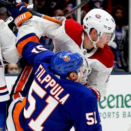 Mar 14, 2019; Uniondale, NY, USA; New York Islanders center Valtteri Filppula (51) and Montreal Canadiens left wing Artturi Lehkonen (62) come together during the third period at Nassau Veterans Memorial Coliseum. Mandatory Credit: Andy Marlin-USA TODAY Sports