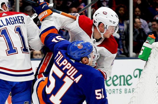 Mar 14, 2019; Uniondale, NY, USA; New York Islanders center Valtteri Filppula (51) and Montreal Canadiens left wing Artturi Lehkonen (62) come together during the third period at Nassau Veterans Memorial Coliseum. Mandatory Credit: Andy Marlin-USA TODAY Sports