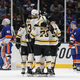 Mar 19, 2019; Uniondale, NY, USA; Boston Bruins center Sean Kuraly (52) celebrates with teammates after scoring a goal against New York Islanders goalie Robin Lehner (40) during the second period at Nassau Veterans Memorial Coliseum. Mandatory Credit: Brad Penner-USA TODAY Sports