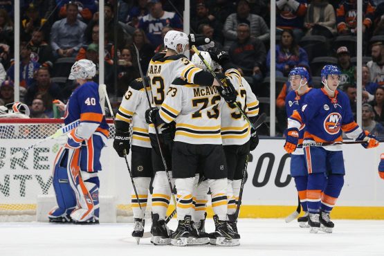 Mar 19, 2019; Uniondale, NY, USA; Boston Bruins center Sean Kuraly (52) celebrates with teammates after scoring a goal against New York Islanders goalie Robin Lehner (40) during the second period at Nassau Veterans Memorial Coliseum. Mandatory Credit: Brad Penner-USA TODAY Sports