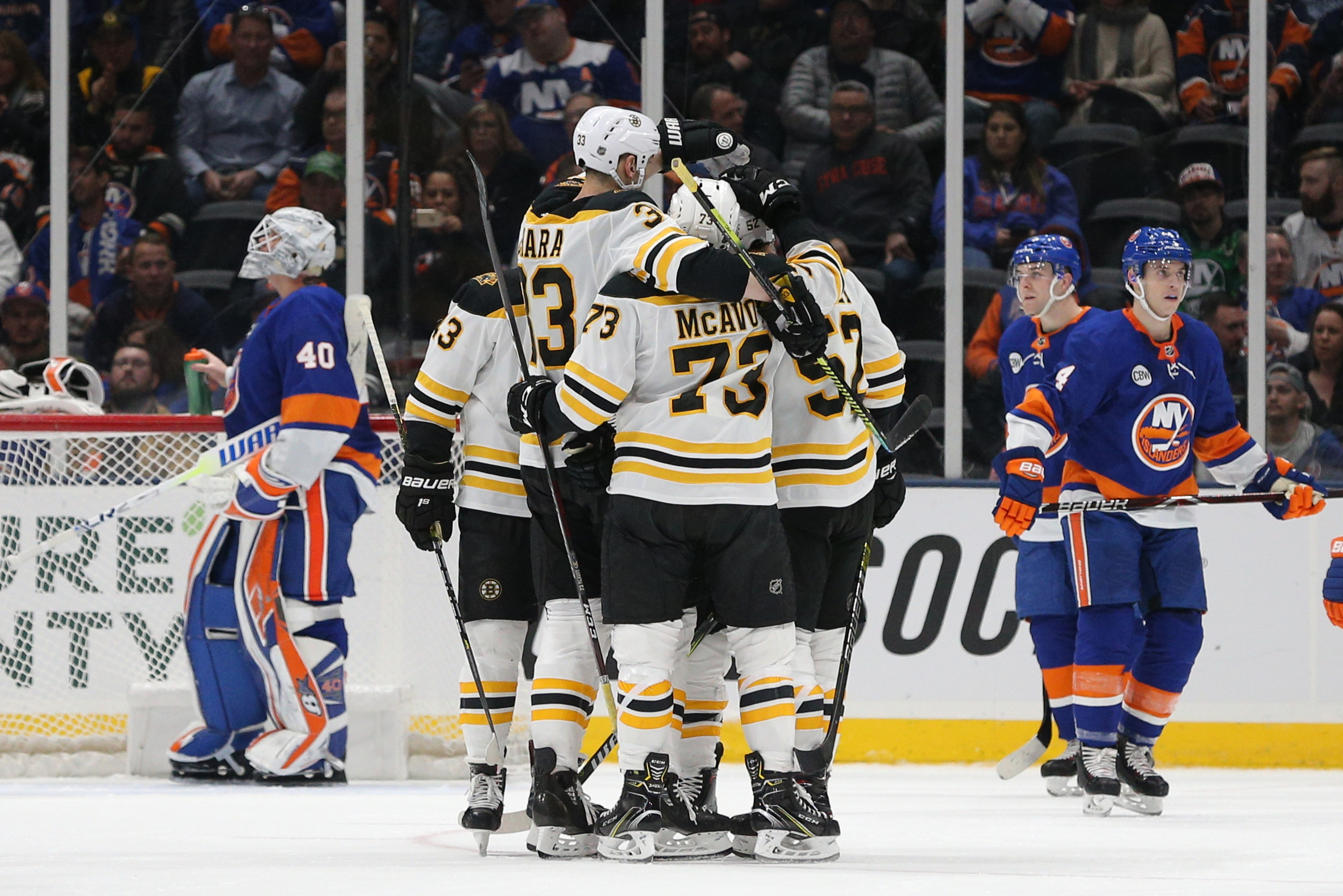 Mar 19, 2019; Uniondale, NY, USA; Boston Bruins center Sean Kuraly (52) celebrates with teammates after scoring a goal against New York Islanders goalie Robin Lehner (40) during the second period at Nassau Veterans Memorial Coliseum. Mandatory Credit: Brad Penner-USA TODAY Sports