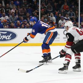 Mar 24, 2019; Uniondale, NY, USA; New York Islanders left wing Andrew Ladd (16) takes a backhanded shot in front of Arizona Coyotes right wing Michael Grabner (40) during the second period at Nassau Veterans Memorial Coliseum. Mandatory Credit: Brad Penner-USA TODAY Sports