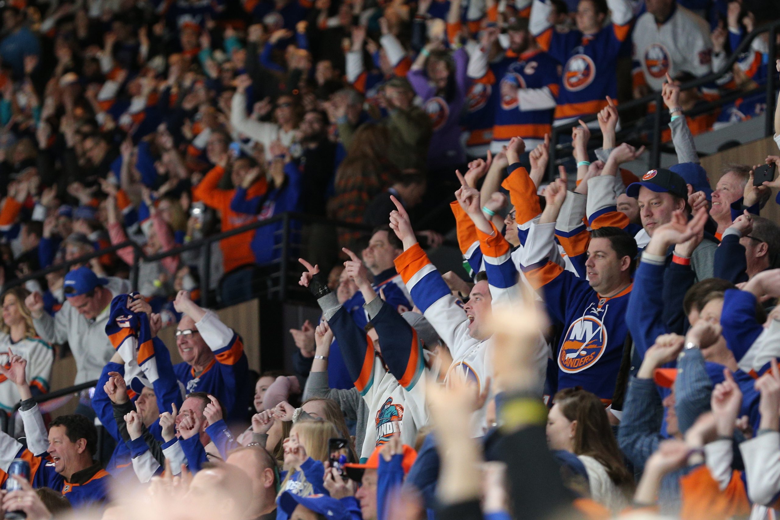 Mar 24, 2019; Uniondale, NY, USA; New York Islanders fans celebrate after an Islanders goal against the Arizona Coyotes during the third period at Nassau Veterans Memorial Coliseum. Mandatory Credit: Brad Penner-USA TODAY Sports
