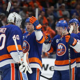 Apr 12, 2019; Uniondale, NY, USA; New York Islanders left wing Anthony Beauvillier (18) celebrates with goalie Robin Lehner (40) after defeating the Pittsburgh Penguins in game two of the first round of the 2019 Stanley Cup Playoffs at Nassau Veterans Memorial Coliseum. Mandatory Credit: Brad Penner-USA TODAY Sports