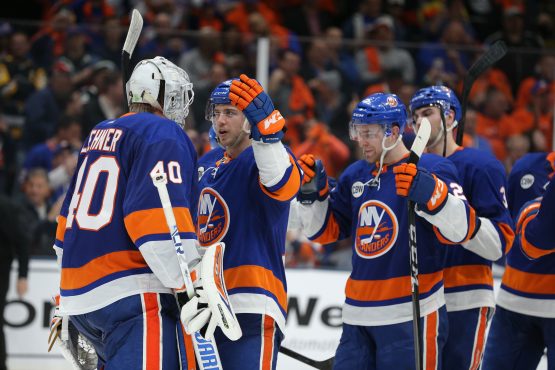 Apr 12, 2019; Uniondale, NY, USA; New York Islanders left wing Anthony Beauvillier (18) celebrates with goalie Robin Lehner (40) after defeating the Pittsburgh Penguins in game two of the first round of the 2019 Stanley Cup Playoffs at Nassau Veterans Memorial Coliseum. Mandatory Credit: Brad Penner-USA TODAY Sports
