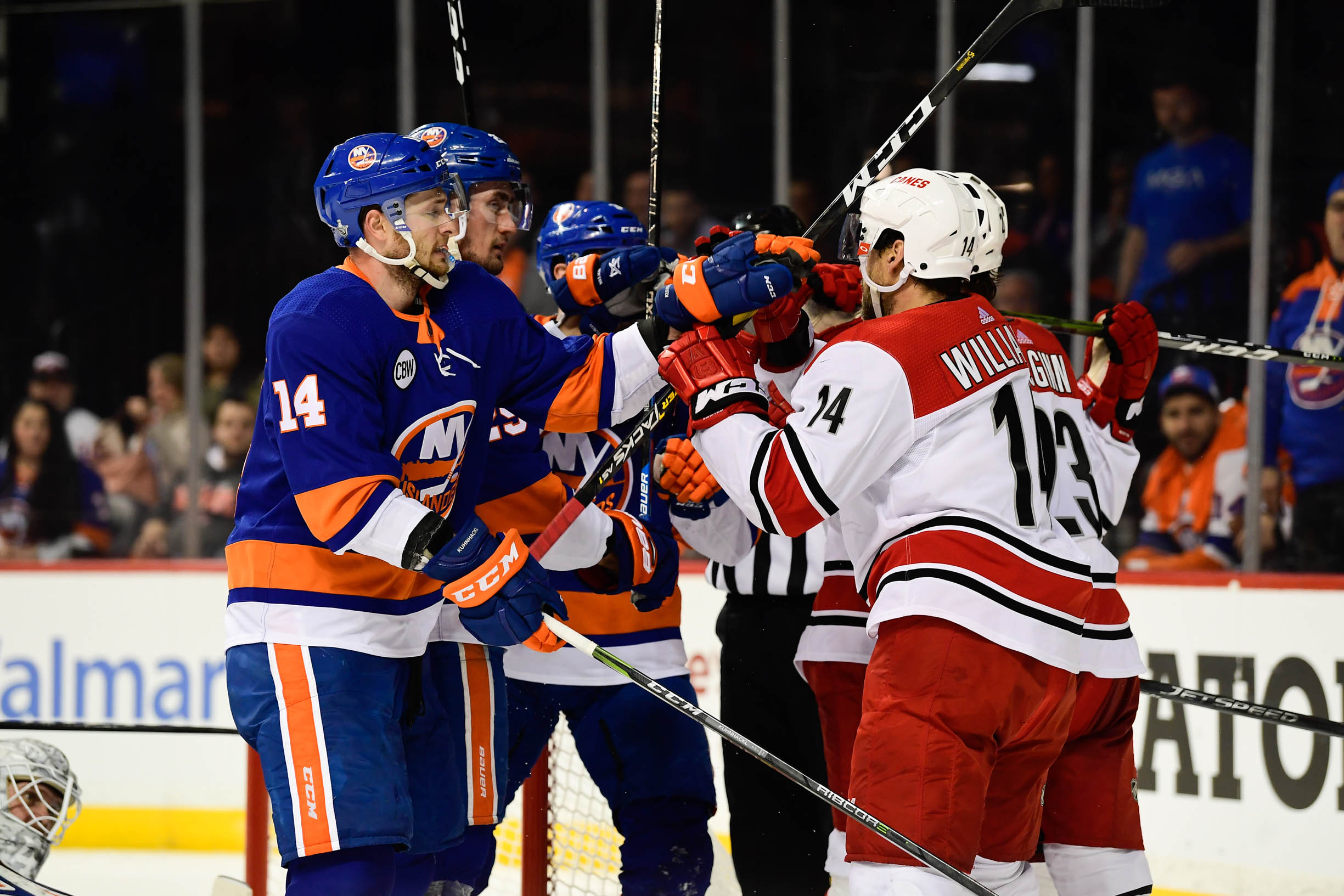 Apr 26, 2019; Brooklyn, NY, USA; New York Islanders right wing Tom Kuhnhackl (14) and Carolina Hurricanes right wing Justin Williams (14) scuffle during the first period in game one of the second round of the 2019 Stanley Cup Playoffs at Barclays Center. Mandatory Credit: Catalina Fragoso-USA TODAY Sports