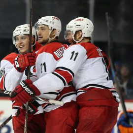 Apr 28, 2019; Brooklyn, NY, USA; Carolina Hurricanes right wing Nino Niederreiter (21) celebrates his goal against the New York Islanders with left wing Teuvo Teravainen (86) and center Jordan Staal (11) during the third period of game two of the second round of the 2019 Stanley Cup Playoffs at Barclays Center. Mandatory Credit: Brad Penner-USA TODAY Sports