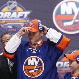 (EDITORS NOTE: caption correction) Jun 24, 2016; Buffalo, NY, USA; Kieffer Bellows puts on a team cap after being selected as the number nineteen overall draft pick by the New York Islanders in the first round of the 2016 NHL Draft at the First Niagra Center. Mandatory Credit: Timothy T. Ludwig-USA TODAY Sports