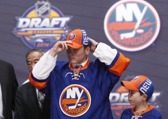 (EDITORS NOTE: caption correction) Jun 24, 2016; Buffalo, NY, USA; Kieffer Bellows puts on a team cap after being selected as the number nineteen overall draft pick by the New York Islanders in the first round of the 2016 NHL Draft at the First Niagra Center. Mandatory Credit: Timothy T. Ludwig-USA TODAY Sports
