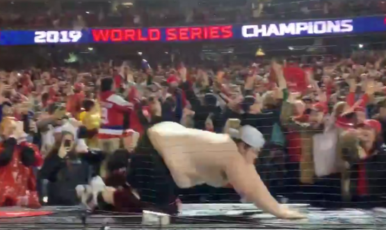 Nationals fan rips off shirt, slides across dugout after Series win