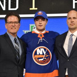 Jun 22, 2018; Dallas, TX, USA; Noah Dobson poses for a photo with team representatives after being selected as the number twelve overall pick to the New York Islanders in the first round of the 2018 NHL Draft at American Airlines Center. Mandatory Credit: Jerome Miron-USA TODAY Sports