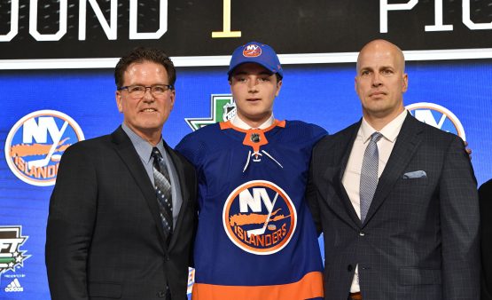 Jun 22, 2018; Dallas, TX, USA; Noah Dobson poses for a photo with team representatives after being selected as the number twelve overall pick to the New York Islanders in the first round of the 2018 NHL Draft at American Airlines Center. Mandatory Credit: Jerome Miron-USA TODAY Sports