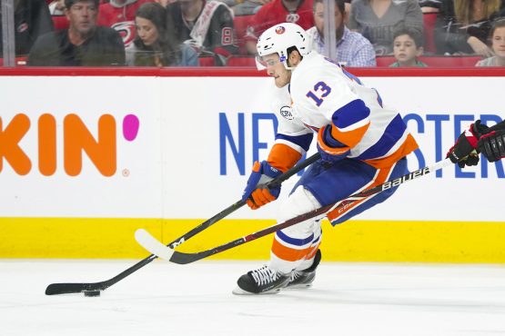 May 3, 2019; Raleigh, NC, USA; New York Islanders center Mathew Barzal (13) skates with the puck against the Carolina Hurricanes in game four of the second round of the 2019 Stanley Cup Playoffs at PNC Arena. The Carolina Hurricanes defeated the New York Islanders 5-2. Mandatory Credit: James Guillory-USA TODAY Sports