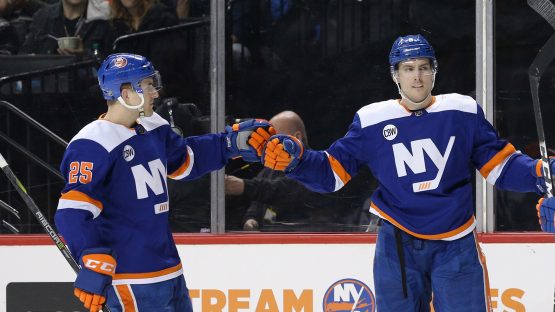 Feb 16, 2019; Brooklyn, NY, USA; New York Islanders defenseman Ryan Pulock (6) celebrates his goal against the Edmonton Oilers with defenseman Devon Toews (25) and left wing Anthony Beauvillier (18) during the second period at Barclays Center. Mandatory Credit: Brad Penner-USA TODAY Sports