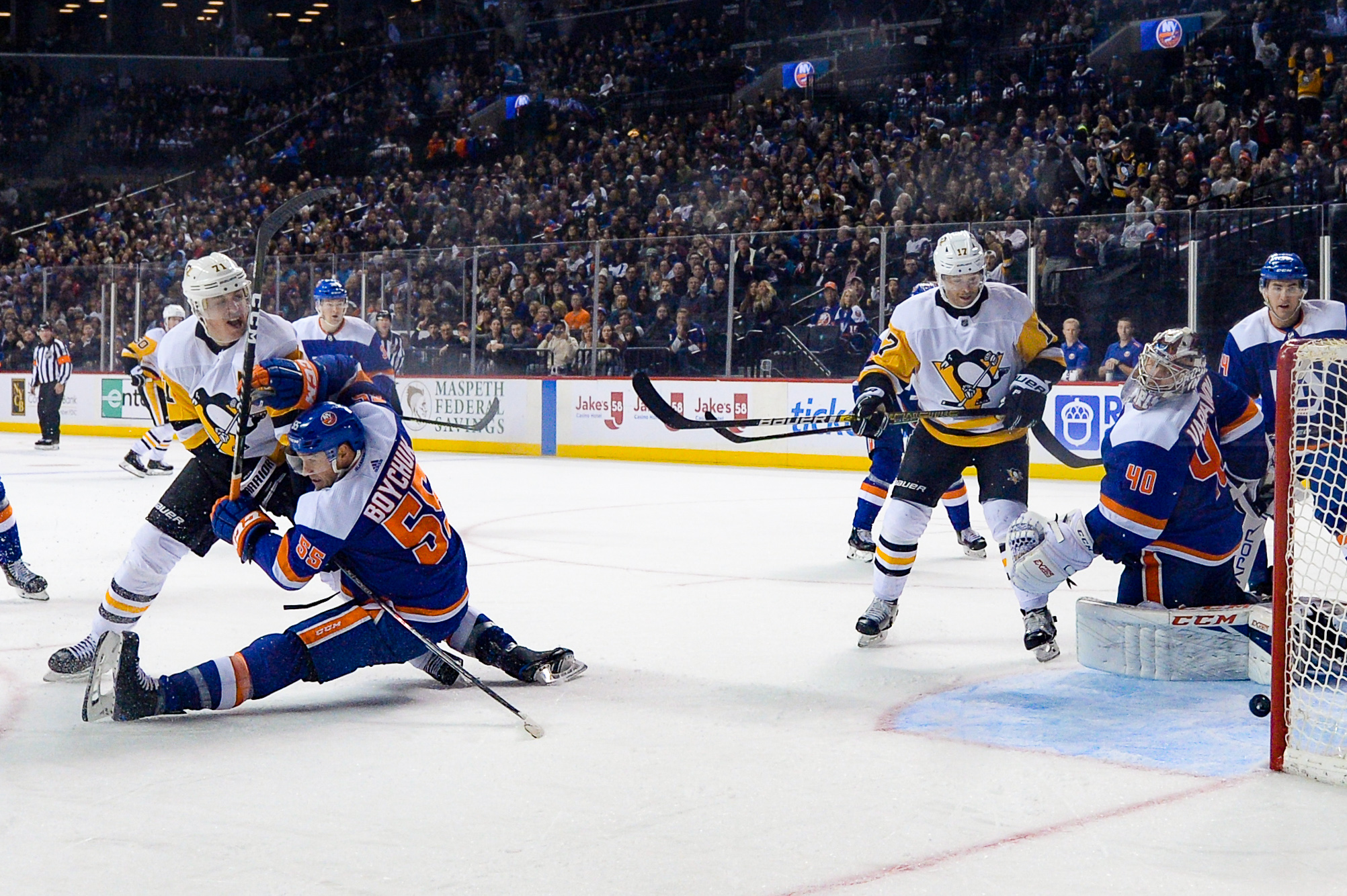 Nov 7, 2019; Brooklyn, NY, USA; Pittsburgh Penguins center Evgeni Malkin (71) scores a goal against New York Islanders defenseman Johnny Boychuk (55) during the third period at Barclays Center. Mandatory Credit: Dennis Schneidler-USA TODAY Sports