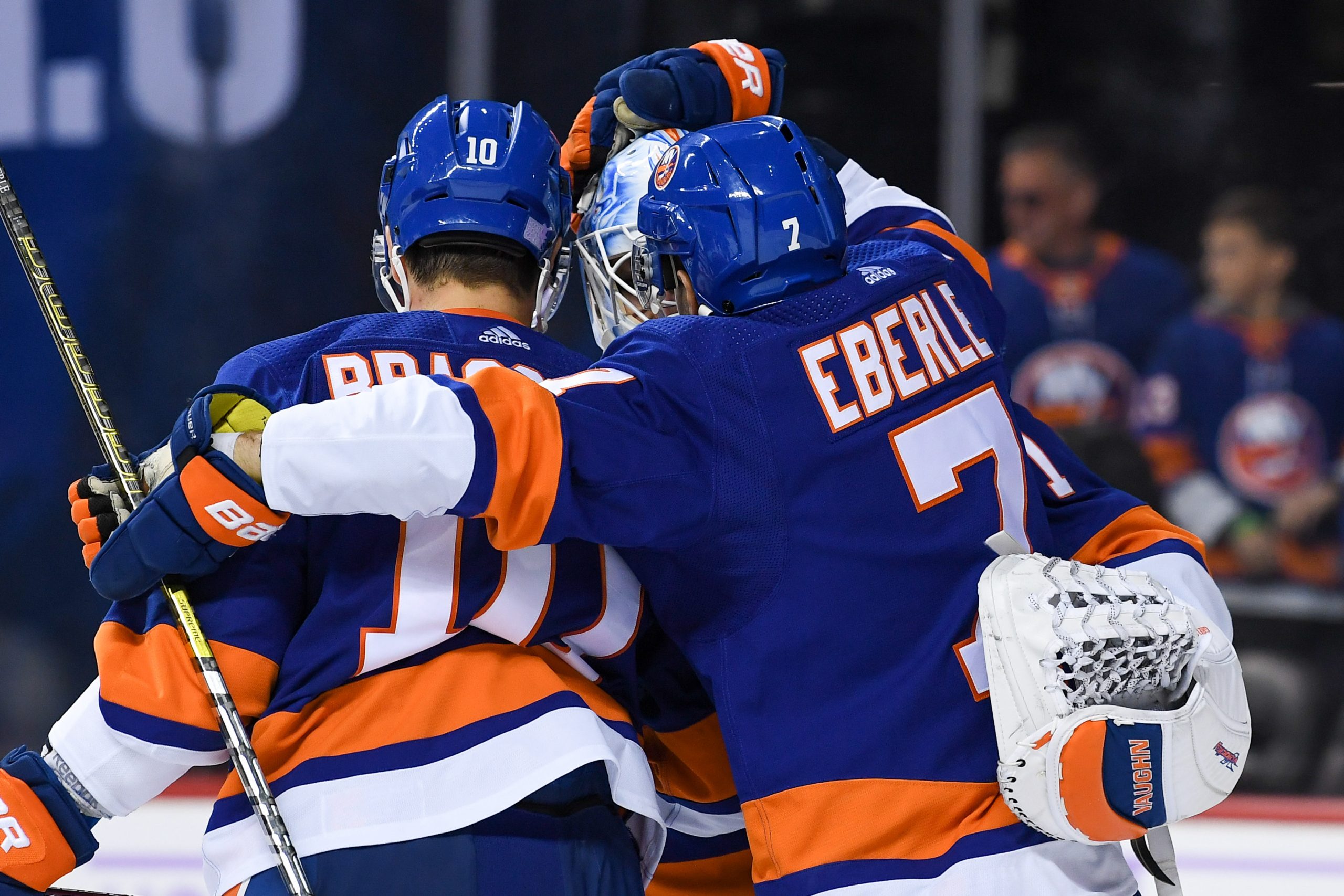 Nov 9, 2019; Brooklyn, NY, USA; New York Islanders center Jordan Eberle (7) and center Derick Brassard (10) congratulate goaltender Thomas Greiss (1) after a 2-1 victory over the Florida Panthers at Barclays Center. Mandatory Credit: Dennis Schneidler-USA TODAY Sports