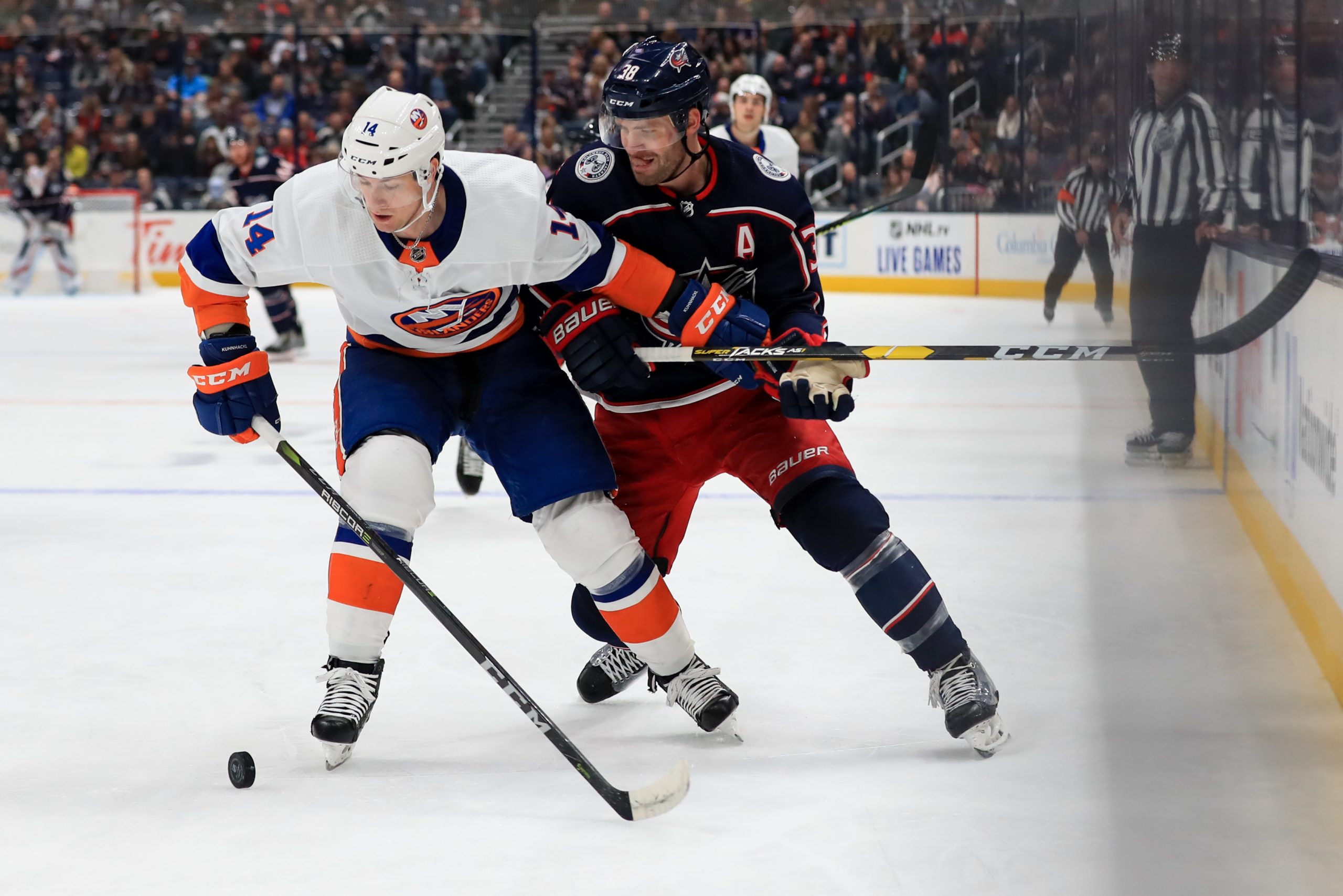 Oct 19, 2019; Columbus, OH, USA; New York Islanders right wing Tom Kuhnhackl (14) skates against Columbus Blue Jackets center Boone Jenner (38) in the second period at Nationwide Arena. Mandatory Credit: Aaron Doster-USA TODAY Sports