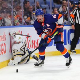 Nov 2, 2019; Buffalo, NY, USA; New York Islanders right wing Cal Clutterbuck (15) looks to make a pass as Buffalo Sabres center Casey Mittelstadt (37) falls down during the third period at KeyBank Center. Mandatory Credit: Timothy T. Ludwig-USA TODAY Sports